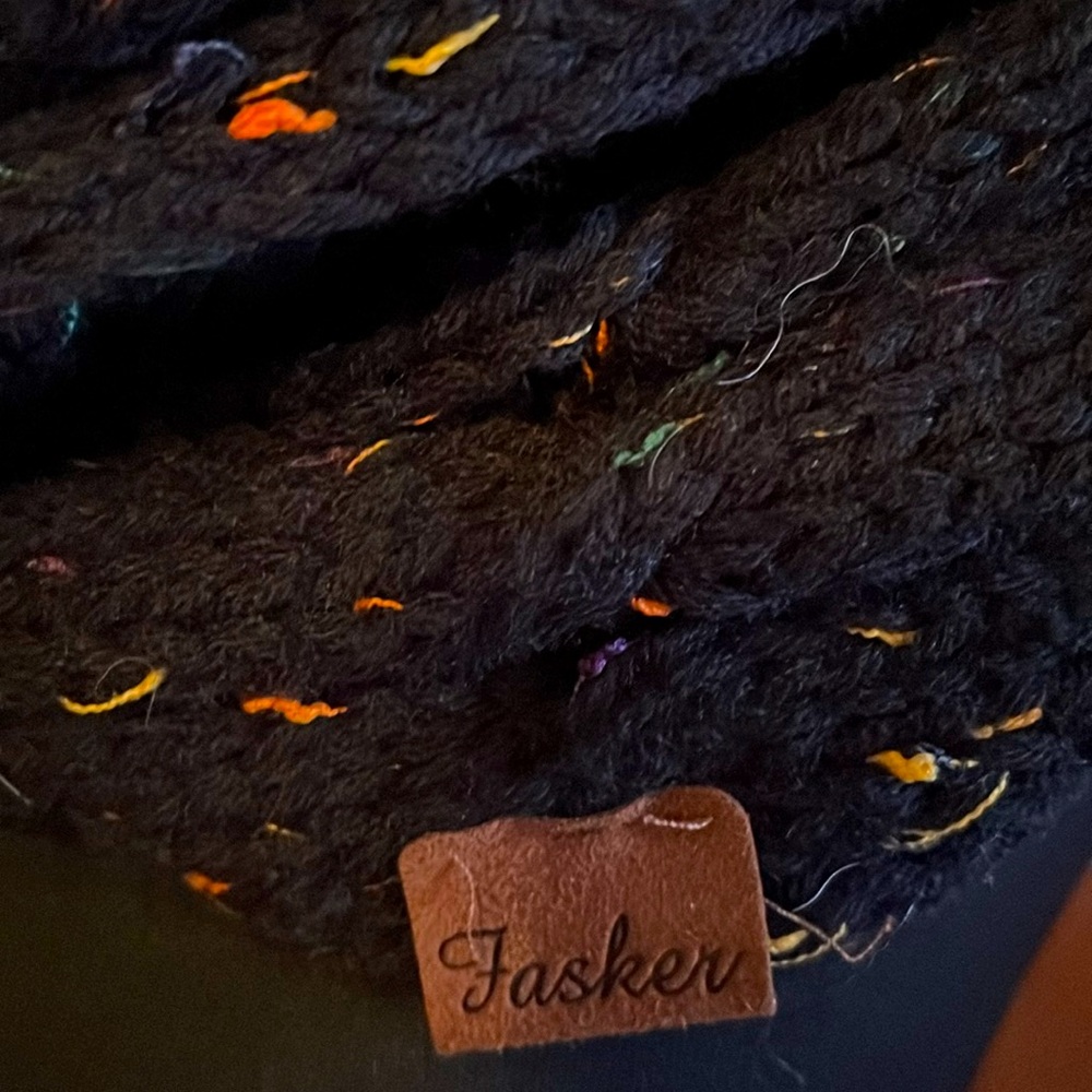 Fasker knitted infinity scarf. Black flecked w bright colors.